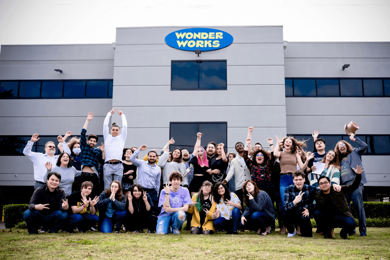 Image of the Wonder Works team, all grouped up in front of our office.