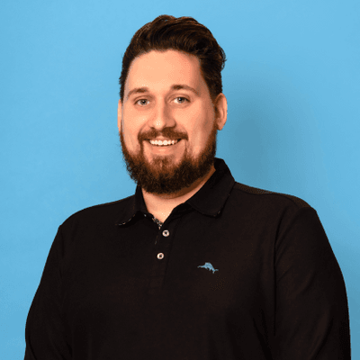 Portrait image of Zach Letter against a pale blue background.